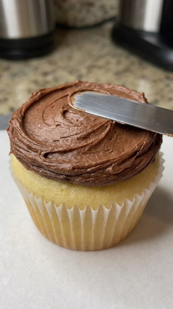 construction excavator cupcakes with chocolate frosting and cookie crumbs