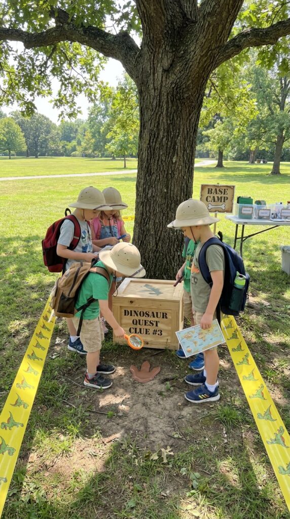 Kids following clues in a dinosaur treasure hunt