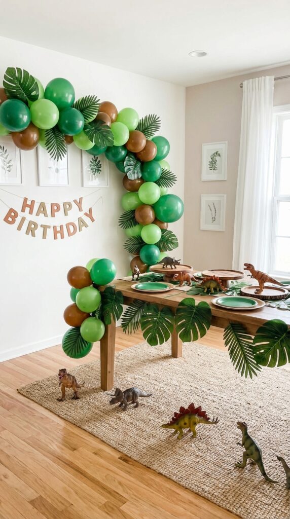 Dinosaur themed balloon jungle setup with green and brown balloons