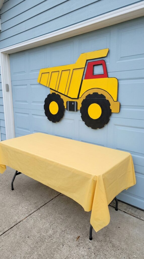 dump truck dessert table backdrop for construction birthday party