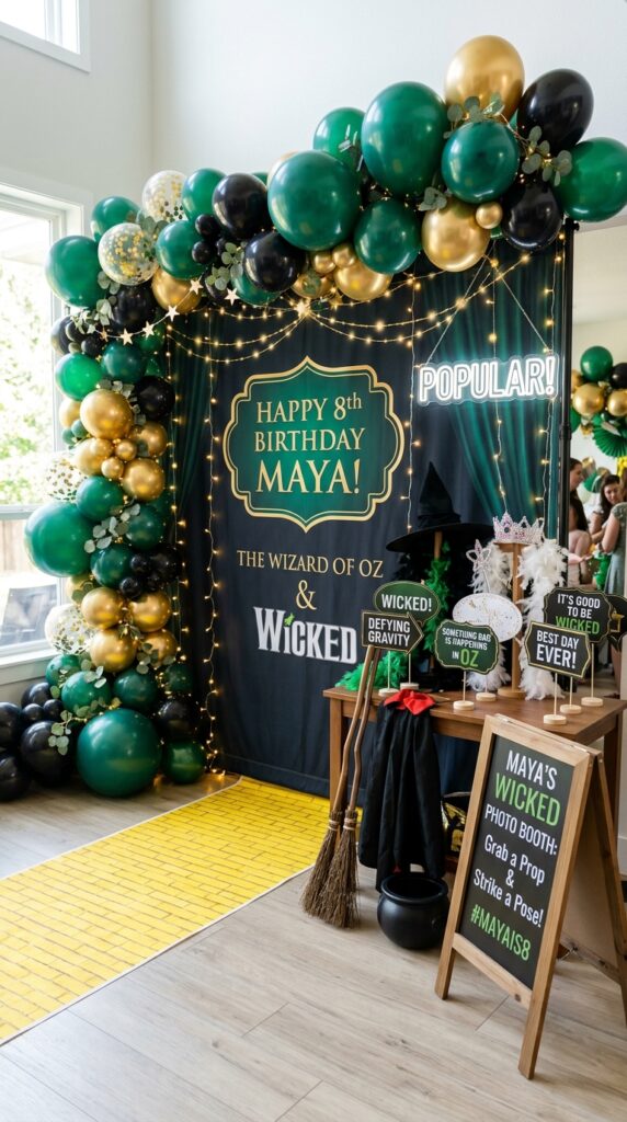 Wicked themed birthday photo booth with magical fantasy party decorations.