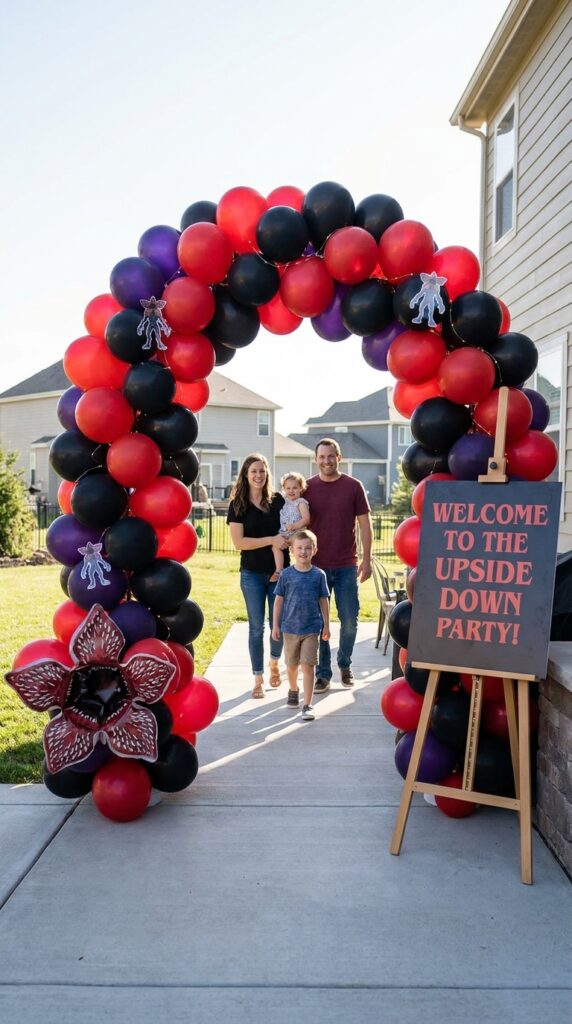 Demogorgon themed balloon arch for birthday party with red, black, and white balloons