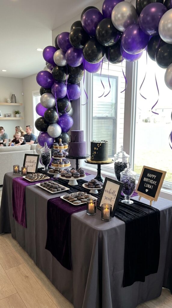 Wicked themed birthday dessert table with dramatic party treats and decorations