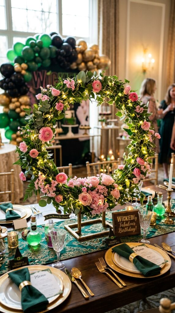 Glowing floral hoop centerpiece for elegant Wicked birthday party decor.